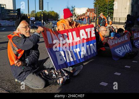 Protesters from Insulate Britain blocking Great Charles Queensway in Birmingham. Picture date: Tuesday November 2, 2021. Stock Photo