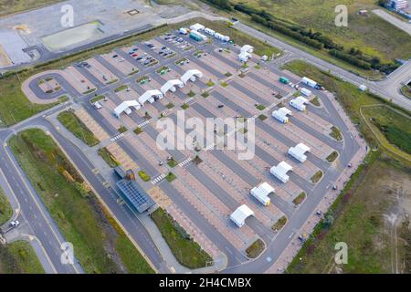 Aerial photo of the Covid-19 drive-through testing site in Leeds West Yorkshire showing the car park testing facilities and covid tents Stock Photo