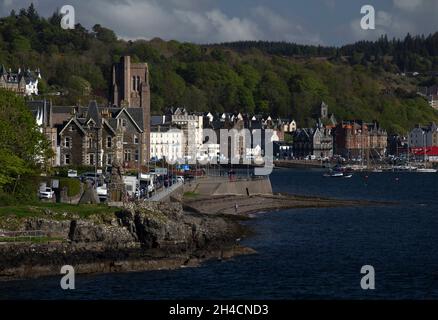 A view along the coast at Oban, Scotland with the Cathedral of St Columba Stock Photo