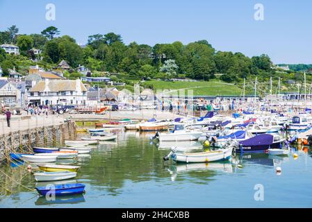 Fishing boats and Yachts in the Jurassic coast harbour at Lyme Regis Dorset England UK GB Europe Stock Photo