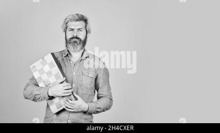 bearded man hold chess board. intelligence quotient. human brain working. brainstorming concept. play chess tournament. copy space. Intelligence level Stock Photo