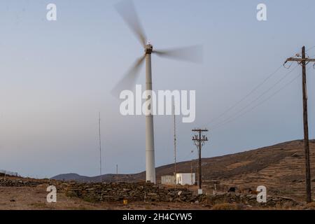 Wind turbine generator on top of Agios Romanos,Tinos,Greece Stock Photo