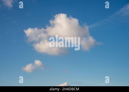 Single white cloud in a blue sky Stock Photo