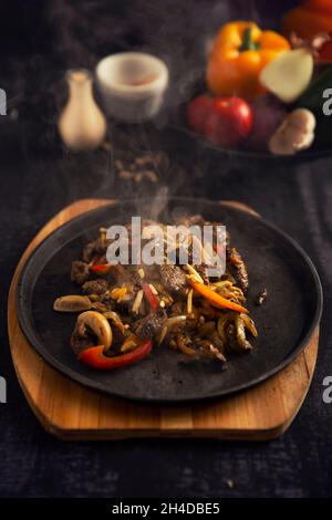 Sliced veal steaks with vegetables and bell pepper Stock Photo