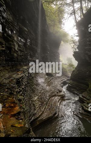Vertical shot of a canal in the Watkins Glen Park Stock Photo