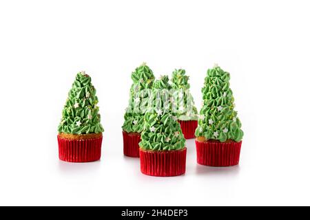 Christmas tree cupcakes isolated on white background Stock Photo