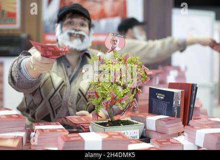 A stall in the exhibition centre at the Conservative Party Conference 2015, in Manchester Central, offer free 'Bank of Labour' notes with Jeremy Corbyn's face printed on it. Stock Photo