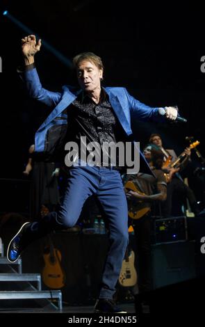 Sir Cliff Richard performs in concert at the Royal Albert Hall in central London, as part of his 75th birthday tour.  Stock Photo