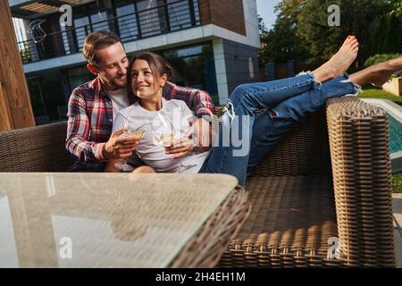 Pretty Caucasian woman and handsome man resting together in the country Stock Photo