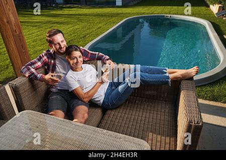Charming elegant woman and handsome male relaxing together in the outdoors Stock Photo