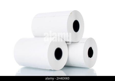 Three rolls of paper cash register tape, close-up isolated on white. Stock Photo