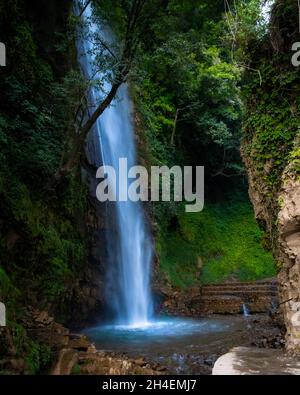 A vertical shot of the beautiful waterfall in the forest Stock Photo ...