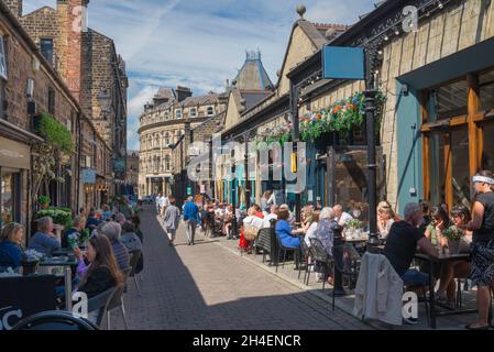Harrogate cafe, view in summer of people relaxing outside popular bars and cafes in John Street, Harrogate, North Yorkshire, England, UK Stock Photo