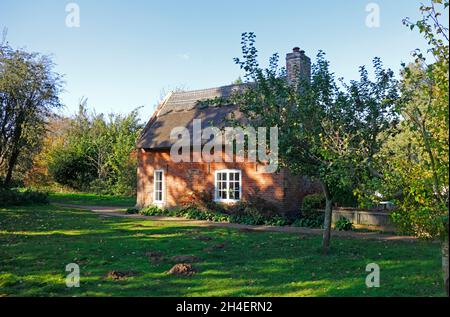 A view of Toad Hole Cottage, a former Marshman's home, by the River Ant on the Norfolk Broads at How Hill, Ludham, Norfolk, England, United Kingdom. Stock Photo