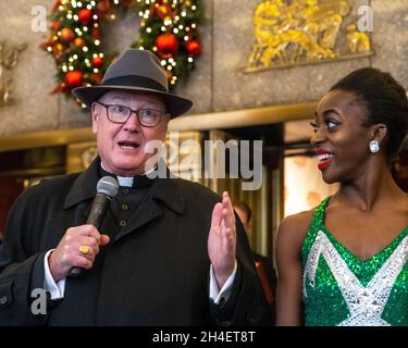 New York, USA. 1st Nov, 2021. New York City's Archbishop Timothy Dolan (L) talks next to a Rockette before blessing the animals that will appear in a living Nativity scene at the Radio Citiy Music Hall Christmas Spectacular in New York City. The show returns after having been cancelled last year during the pandemic lockdown. Credit: Enrique Shore/Alamy Live News Stock Photo