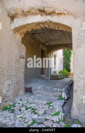 A passageway in the historic hill village of Vrbnsk, on Krk island in the Primorje-Gorski Kotar County of western Croatia Stock Photo