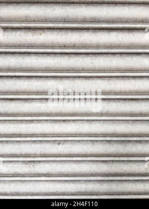 Close up of weathered grey metal roller shutter texture Stock Photo