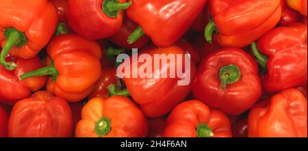 A lot of red bell pepper, texture background. Pile of fresh ripe red bulgarian pepper pattern, high quality Stock Photo