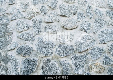 Stone wall texture background. Gray stone wall background. Stock Photo