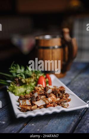 beer appetizer ribs on a wooden background. Stock Photo