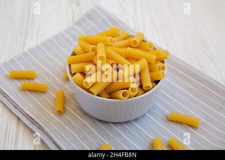 Dry Rigatoni Pasta in a gray Bowl, low angle view. Stock Photo