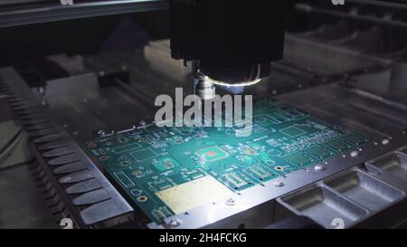 Printed circuit boards production factory. Technological process. Microchip production factory. Production of electric boards at factory. Stock Photo