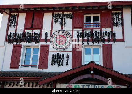 House covered in chillies in the famous village of Espelette, Pays Basque, Pryenees Atlantic, France Stock Photo