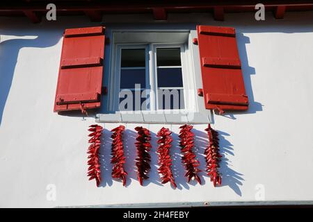 House covered in chillies in the famous village of Espelette, Pays Basque, Pryenees Atlantic, France Stock Photo