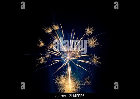 Colorful Fireworks, gold, silver and blue, long exposure, horizontal format Stock Photo