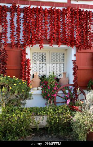 House covered in chillies in the famous village of Espelette, Pays Basque, Pryenees Atlantic, France Stock Photo