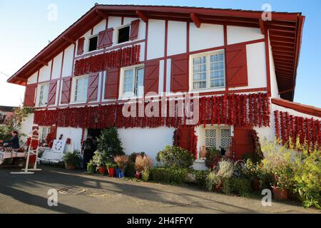 House covered in chillies in the famous village of Espelette, Pays Basque, Pryenees Atlantic, France Stock Photo