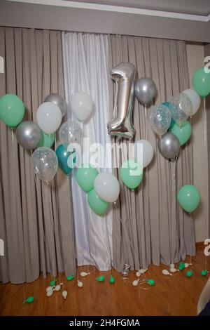Silver chrome number 1 made of inflatable balloon with silver ribbon ...
