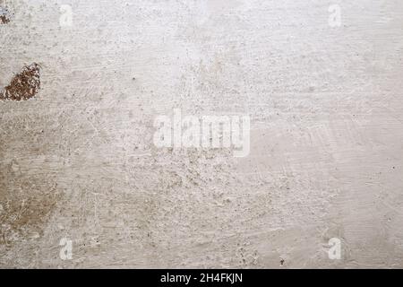 Texture of the whitewashed wall with scuffs, scratches and dirty spots Stock Photo