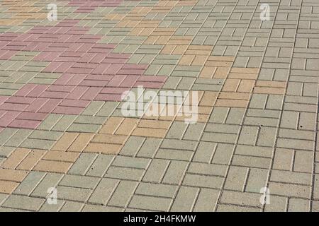 Multicolored background of paving slabs on a city street. Simple beautiful paving stones. Stock Photo
