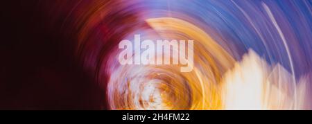 Horizontal abstract colorful background with circular lines. The disappearing city in the cycle of sunset. Fantastic backdrop. Stock Photo