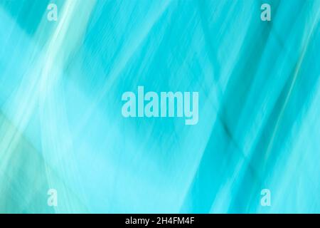 Abstract mint blue turquoise background covered with folds, waves and highlights. Beautiful backdrop. Stock Photo