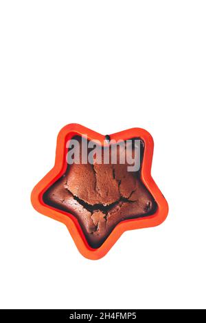 Delicious homemade chocolate chip cookies with tender cracks on a white background. Baking dish in the form of a star. Self cooking and Christmas concept. Copy Space Stock Photo