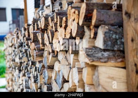 Abstract patterns of cut firewood used by local people in the high altitudes of eastern Europe. Stock Photo