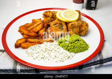 Vegan fish and chips with vegan sauce, tofu and chips with lemon. heath eating. Stock Photo