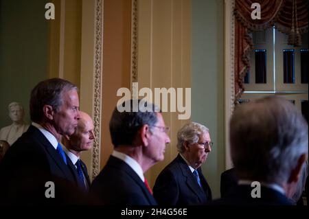 United States Senator John Thune (Republican of South Dakota), left, United States Senator Rick Scott (Republican of Florida), second from left, United States Senator John Barrasso (Republican of Wyoming), third from left, United States Senate Minority Leader Mitch McConnell (Republican of Kentucky), second from right, and United States Senator Roy Blunt (Republican of Missouri), right, listen while United States Senator Joni Ernst (Republican of Iowa) offers remarks during a press conference following the Senate Republican's policy luncheon at the US Capitol in Washington, DC, Tuesday, Novemb Stock Photo
