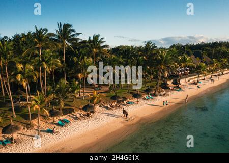 On the beautiful beach of the island of Mauritius along the coast. Shooting from a bird's eye view of the island of Mauritius Stock Photo