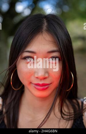 Young Woman Wearing a Grim Reaper Cosplay Outfit in the Woods Stock Photo