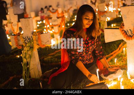 Dhaka, Bangladesh. 02nd Nov, 2021. A Bangladeshi Christian devotee observe All Souls Day in Holy Rosary Church Cemetery . (Photo by Nahid Hasan/Pacific Press) Credit: Pacific Press Media Production Corp./Alamy Live News Stock Photo