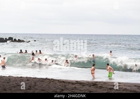 July 26, 2019 Tenerife, Spain, Canary Islands, People on the city beach of Puerto de la Cruz. Stock Photo