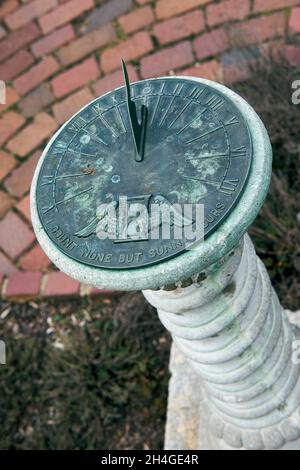 A sundial with a sunny day motto on its face stands in the herb garden of Maymont Estate in Richmond, VA. Stock Photo