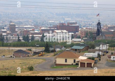 The view of Butte with mine shaft headframe and US flag on top.Butte.Montana.USA Stock Photo