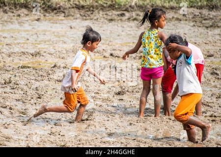 An Giang Sep 21, 2019. Children are playing rice field in the traditional Cambodian field festival Stock Photo