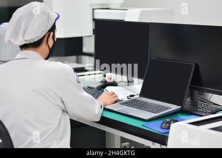 Operator working with computer design product in factory industry Stock Photo