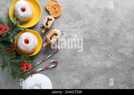 Symbols of Hanukkah with Christmas decor on grunge background Stock Photo