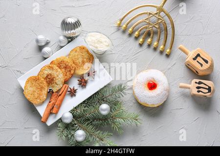 Symbols of Hanukkah with Christmas decor on grunge background Stock Photo